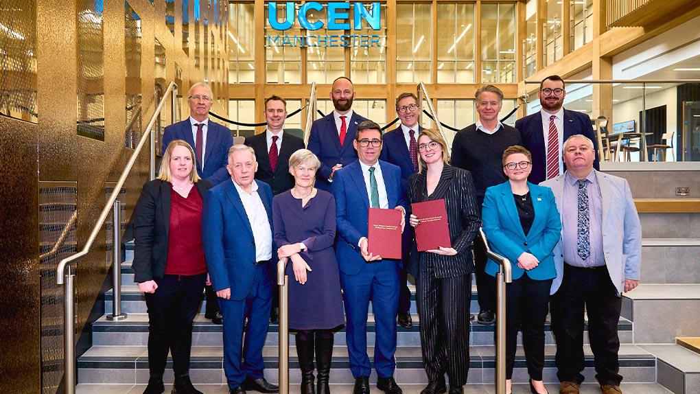 Greater Manchester Mayor Andy Burnham and Levelling Up Minister Dehenna Davison pose with the newly-signed Greater Manchester devolution deal alongside the ten council leaders from across Greater Manchester.