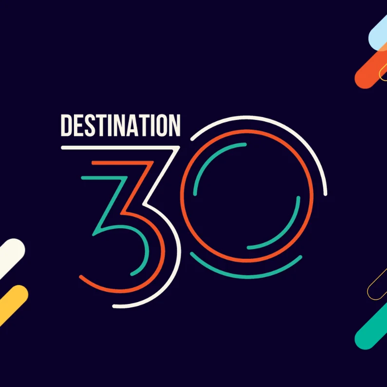Destination 30 graphic featuring the words “Destination 30” in stylised white, orange and teal typography on a dark blue background with geometric accent graphics.
